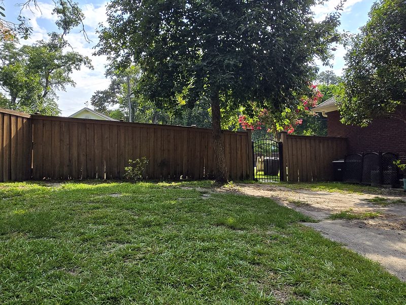 Old wood privacy fence and gate before replacement in West Columbia, SC