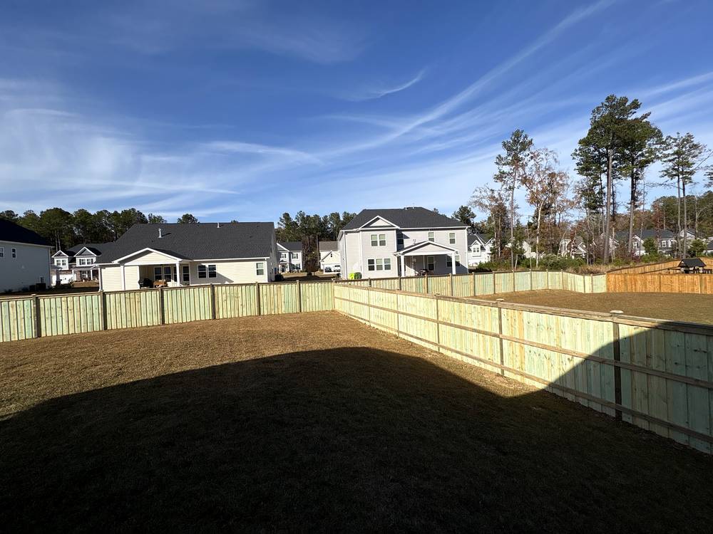 New wood cap and trim fence around a backyard at a new home in Irmo, SC